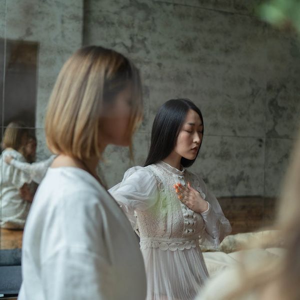 Group of women in a circle during a calm yoga practice.